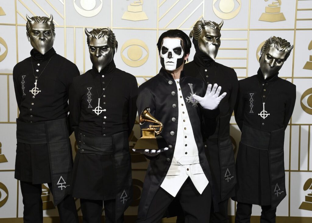 Ghost the band holding a Grammy award